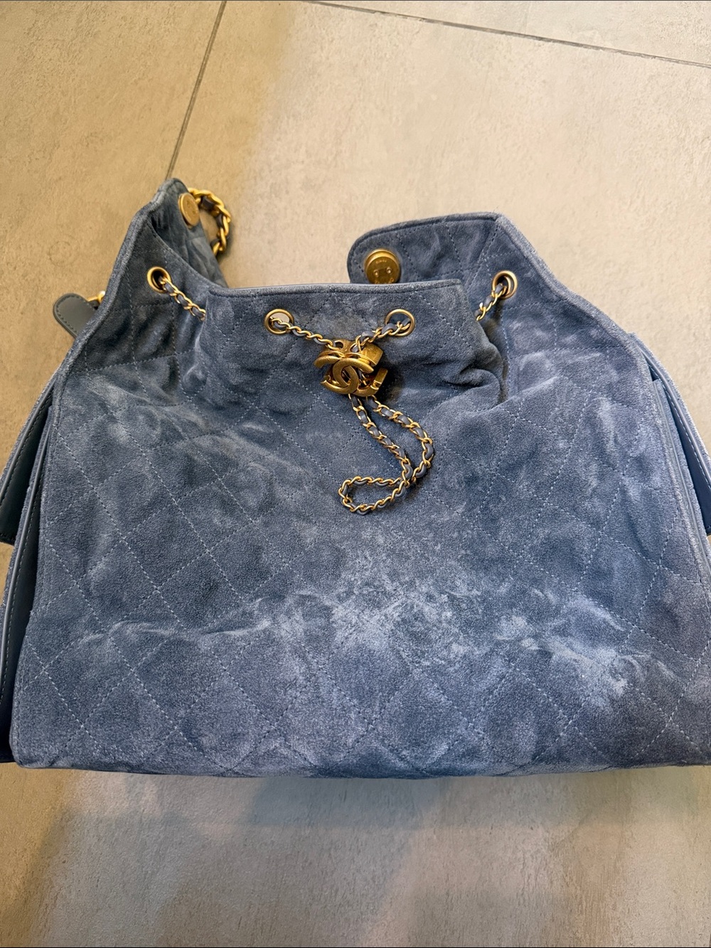 CHANEL 25 in Blue Quilted Suede Drawstring with Gold Hardware